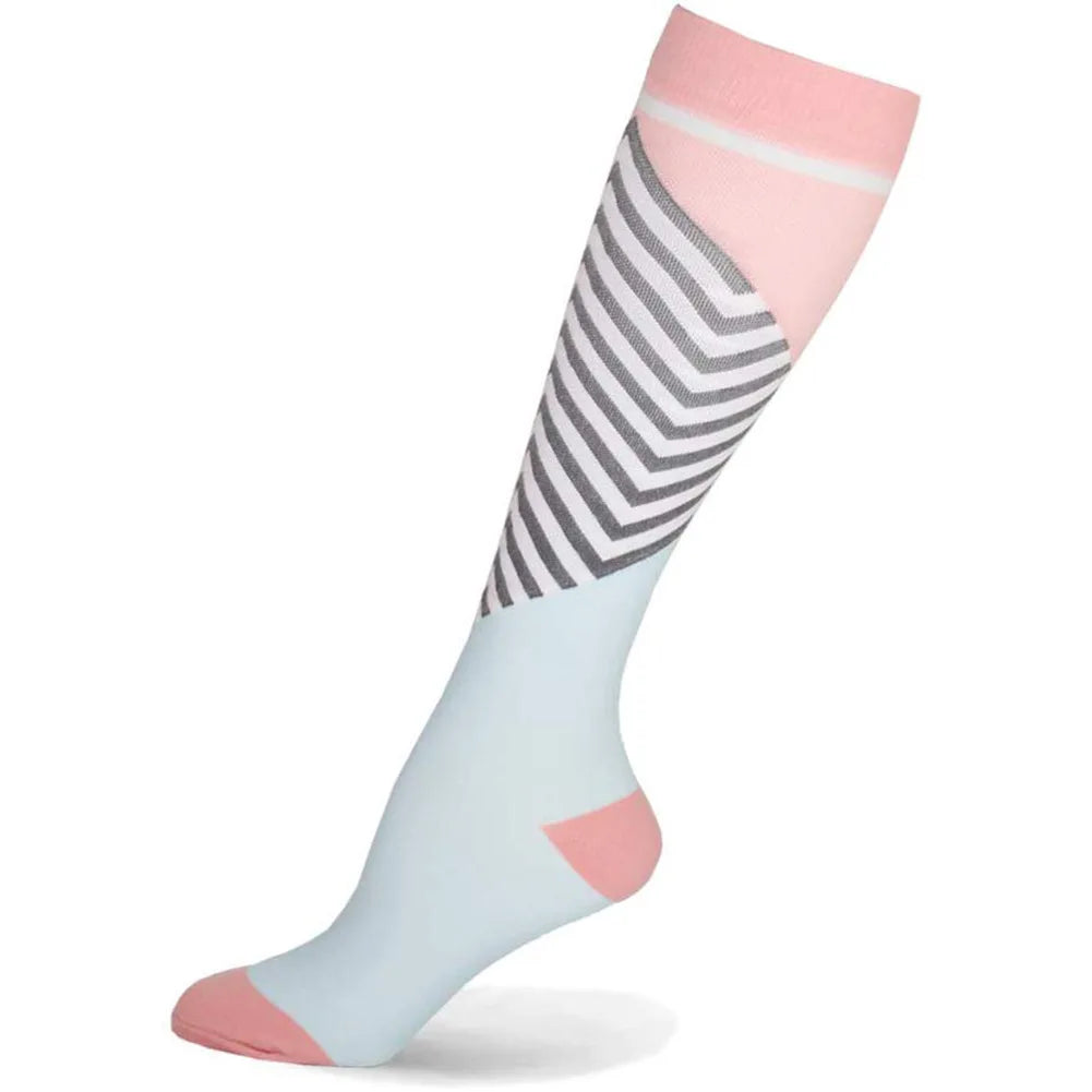 A close-up of a pair of light blue compression socks with pink accents and black stripes.