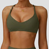 A model wearing a olive green high-support sports bra for yoga and fitness.