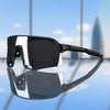 A pair of black UV400 polarized cycling sunglasses resting on a reflective surface.