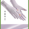 A pair of light purple, skin-friendly driving gloves shown against a green background.