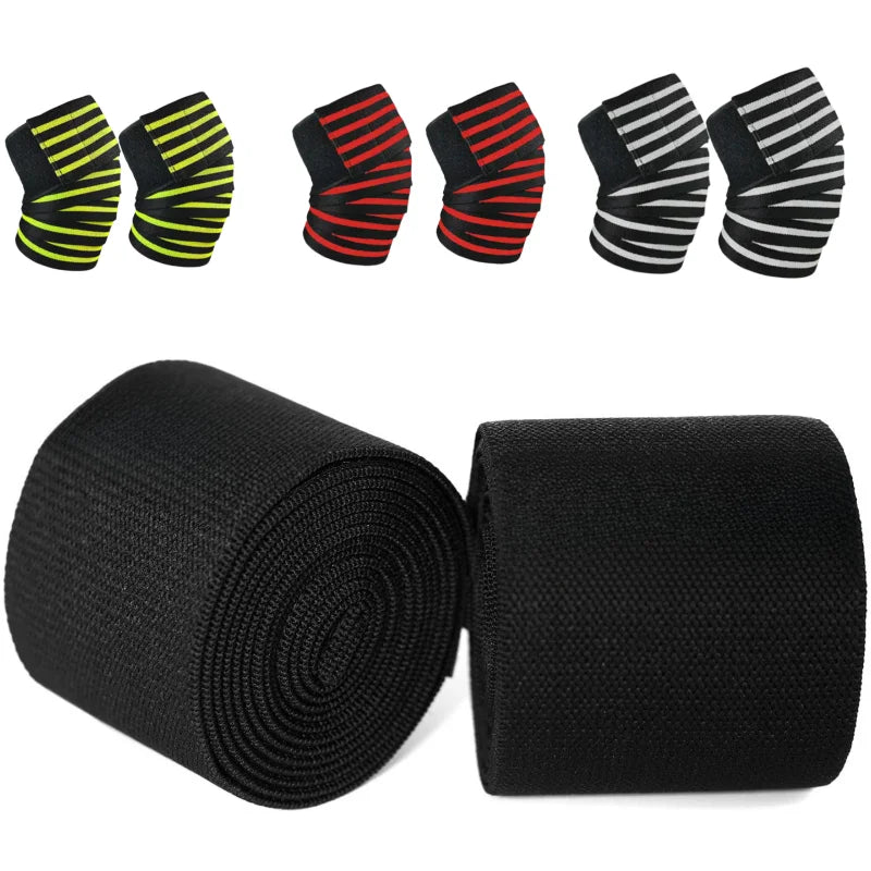 A set of black and yellow striped knee wraps and a black elastic bandage rolled up.