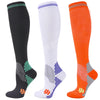 Three pairs of medical grade compression socks in black white and orange showing different patterns.