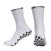 A pair of white performance sports gripping socks shown from the side.