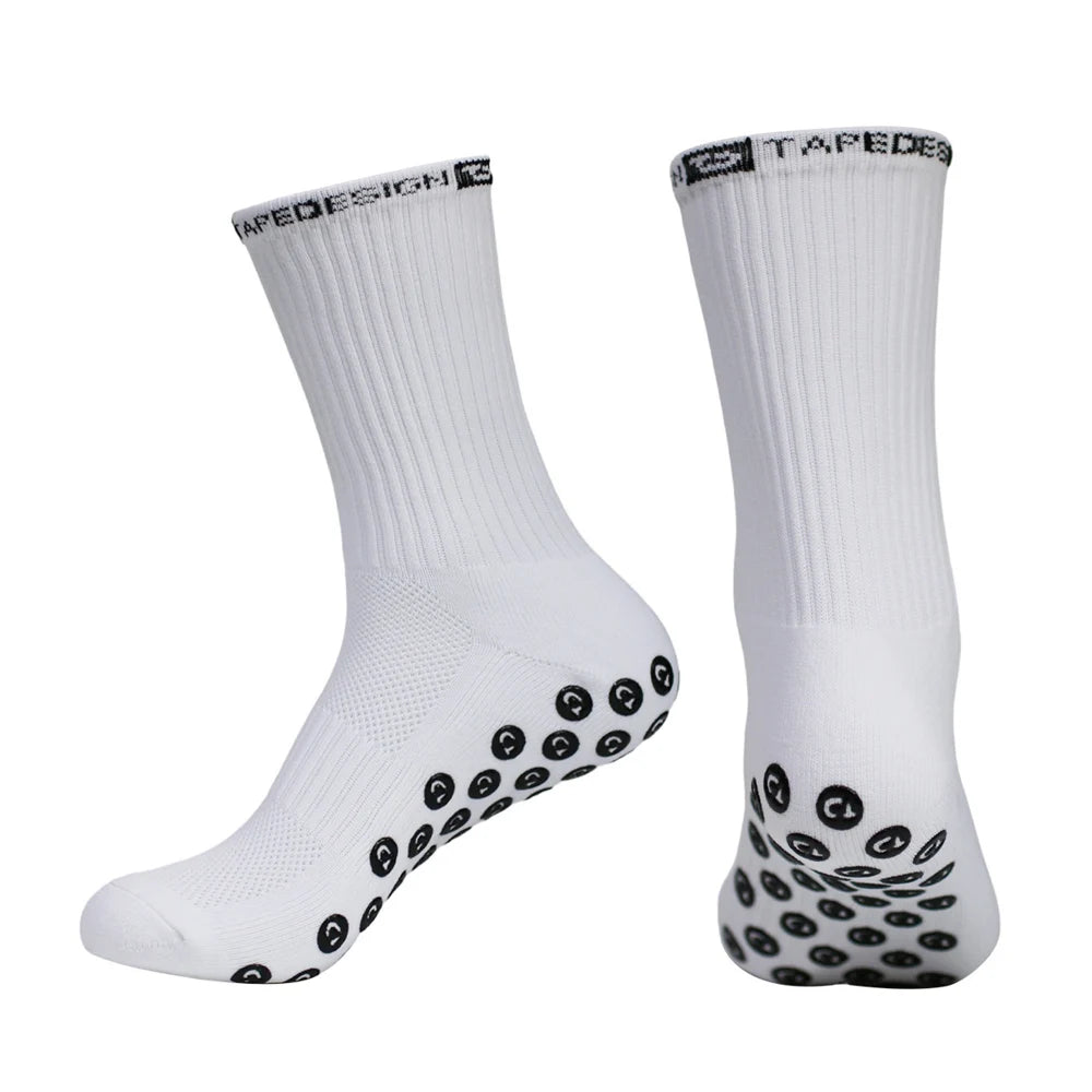 A pair of white performance sports gripping socks shown from the side.