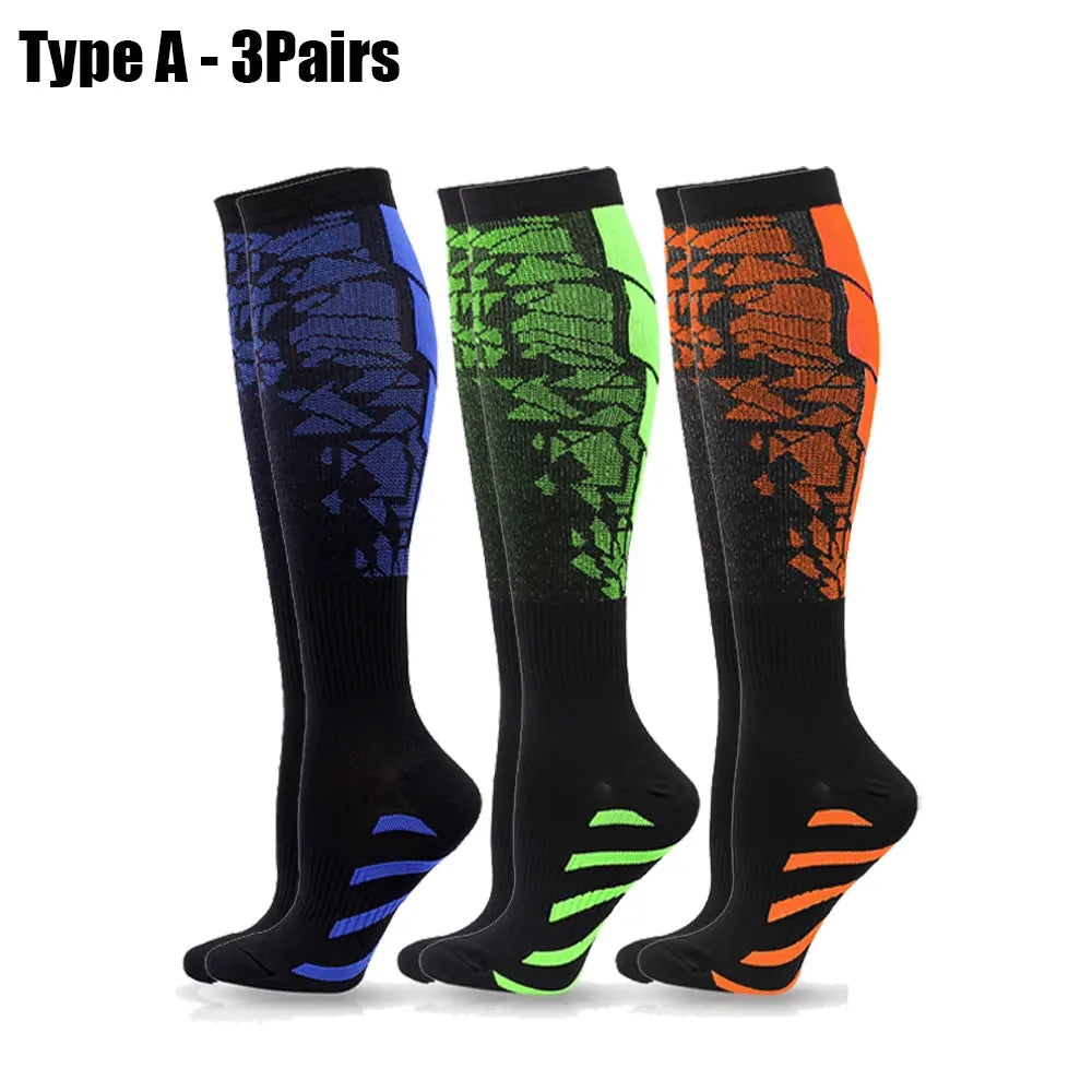 Three pairs of Type A sport compression socks in black, green, and orange colors.