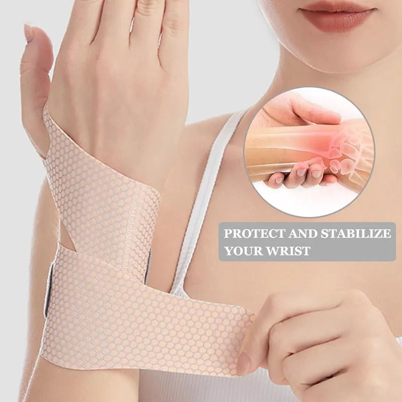 A hand wearing a light pink ultra-thin spandex wrist guard for joint support, demonstrating its protective fit.