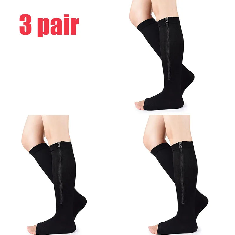 Three pairs of black compression zippered stockings shown on legs.