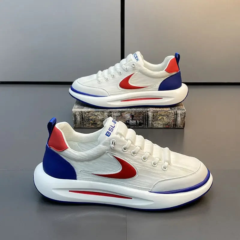 A pair of white and red men's breathable mesh running shoes displayed on a wooden block.