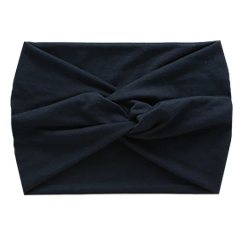 Black women's elastic sports headband folded into a knot