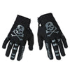 Gants de motocross noirs avec motif crâne et os sur le dos et accents argentés sur les doigts