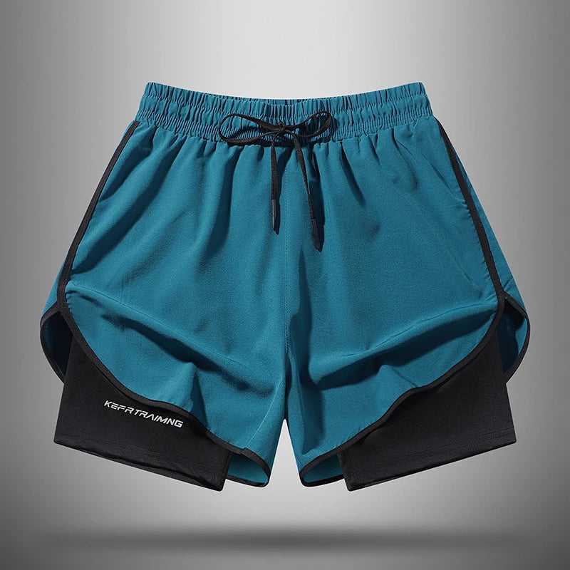 A pair of teal athletic shorts with black drawstring and side panels shown flat.