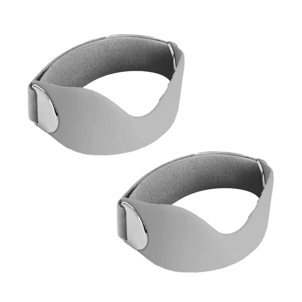 A pair of gray adjustable silicone knee pads with silver accents shown from the side.