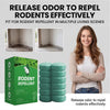 A woman holds a box and twelve green rodent repellent balls, demonstrating the product for pest control.