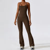 A woman wearing a dark brown women's performance tracksuit set.
