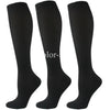 A set of three black compression socks for athletes and medical use