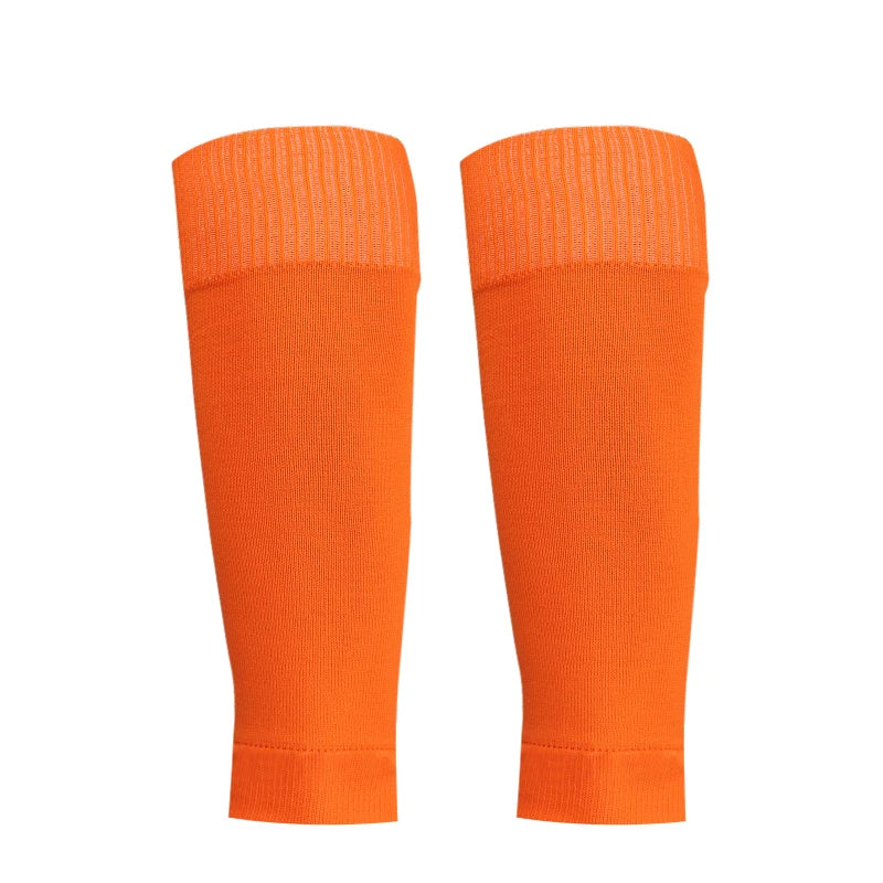 A pair of bright orange honeycomb grip football socks shown vertically.