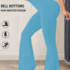 A person wearing light blue flared yoga trousers with a high waisted design is shown in a full-length shot.