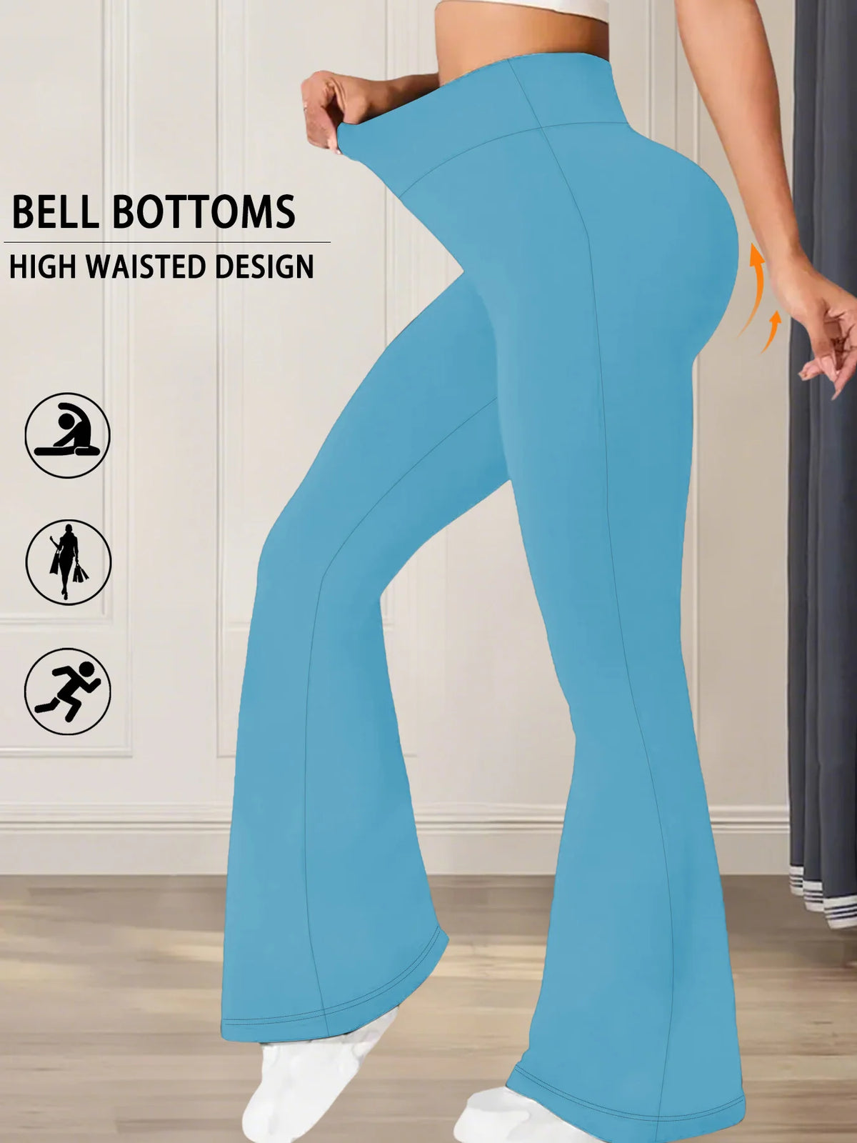 A person wearing light blue flared yoga trousers with a high waisted design is shown in a full-length shot.