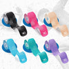 Various colors of Prime Synthetic Kinesiology Tape rolled out on a white background.