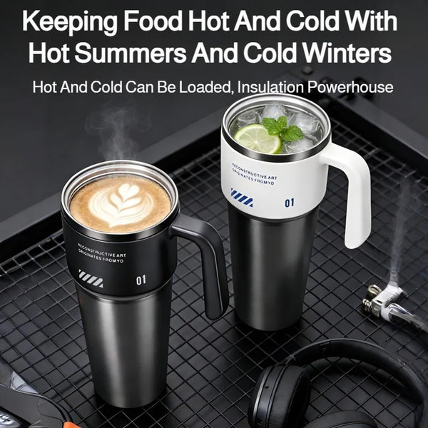 A black insulated stainless steel tumbler filled with ice and a lime slice sits on a black mesh tray.