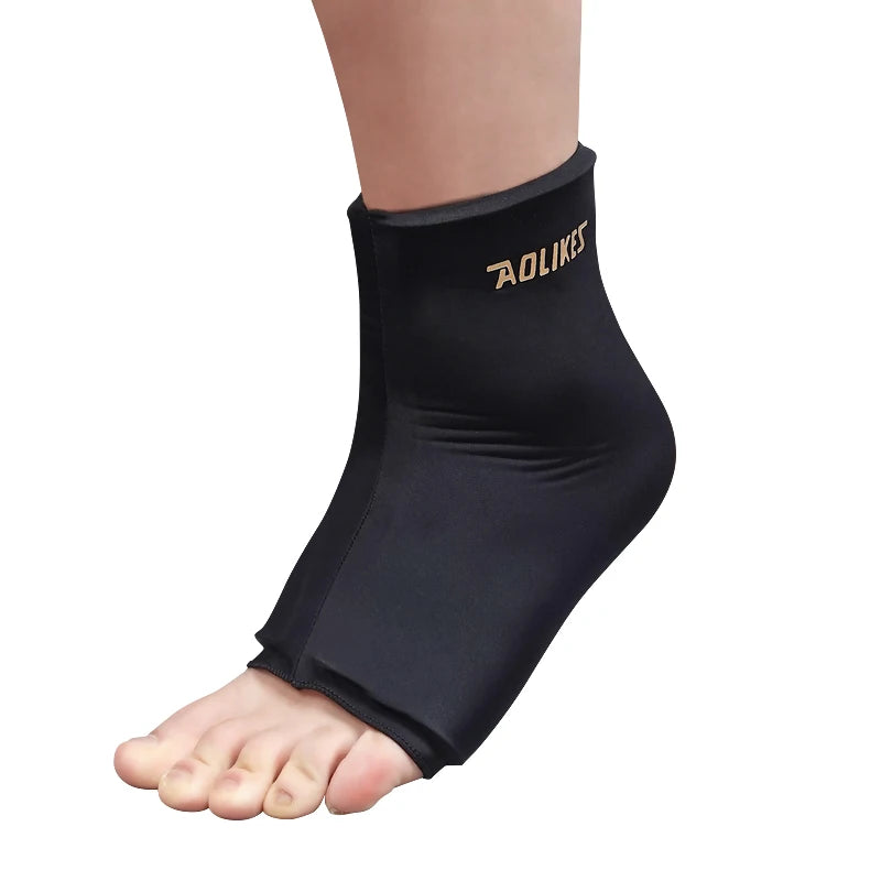 Black AOLIKES knee sleeve worn on a foot, showing the compression design.