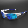 White and blue wraparound sports sunglasses with a blue-tinted lens resting on a dark surface.