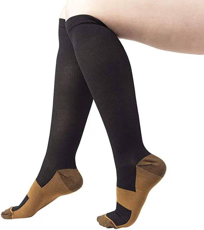 Black medical grade compression socks with tan heel and toe accents