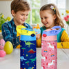 A pink and blue insulated stainless steel thermos cup featuring cartoon animal patterns, held by a child.