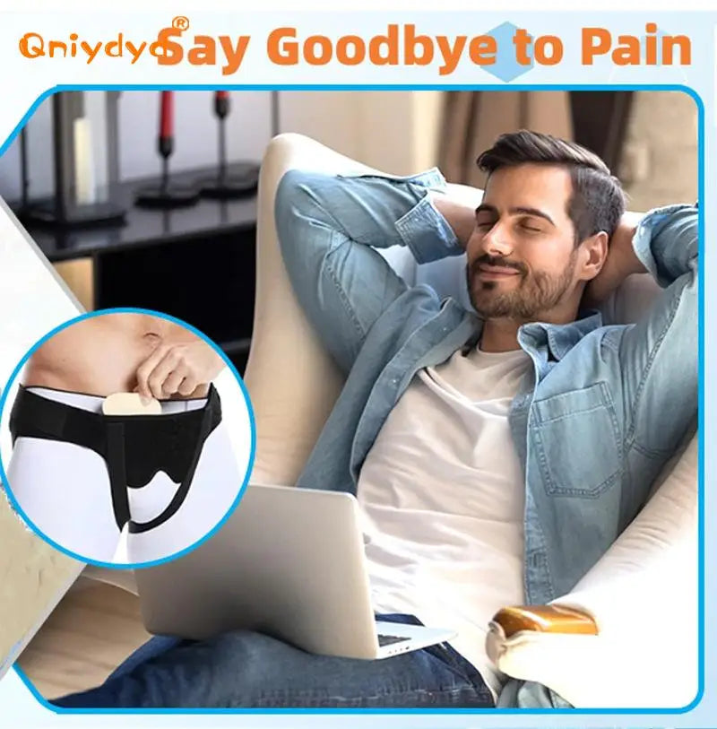 A man is shown wearing an inguinal hernia support belt while relaxing and using a laptop.