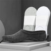 A pair of gray boat socks displayed next to white socks on a gray background.