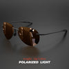 A pair of brown polarized light aviator sunglasses resting on a dark surface.