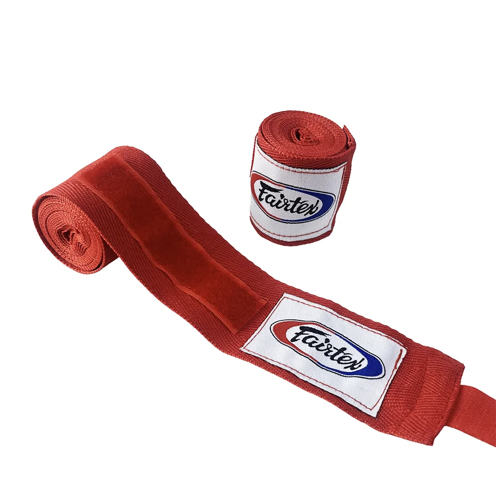 A red boxing hand wrap is shown unwrapped, with a rolled-up piece visible nearby.