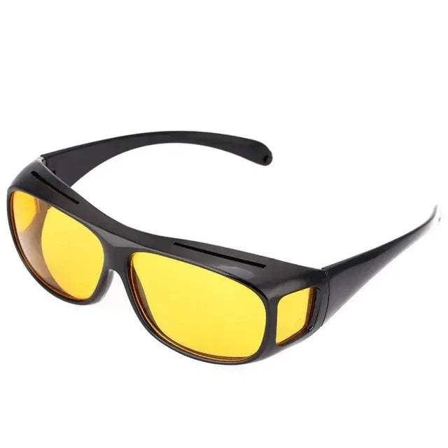 A pair of black night vision driving sunglasses with bright yellow lenses.