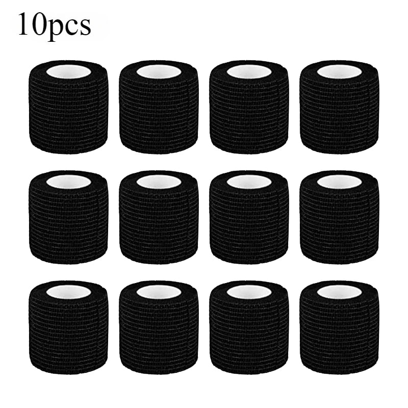 Ten rolls of black tattoo grip bandage tape stacked in a row.