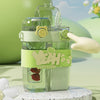 A clear double-walled drinking cup with a straw and lid, featuring a cute lion design on the body.