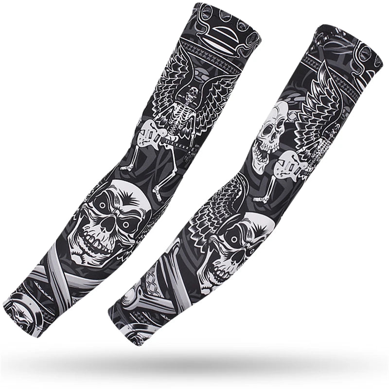 A pair of black and white graphic sports arm sleeves featuring skulls and wings for UV protection.