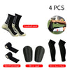 Four pairs of black football socks, sport bandages, shin pads, and shin guard socks.