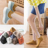Eight pairs of low-cut ankle socks with smiling embroidery in various earthy tones