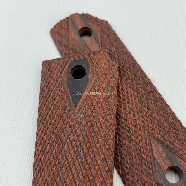 Close-up view of dark rosewood DIY knife grip patches showing intricate wood grain texture.