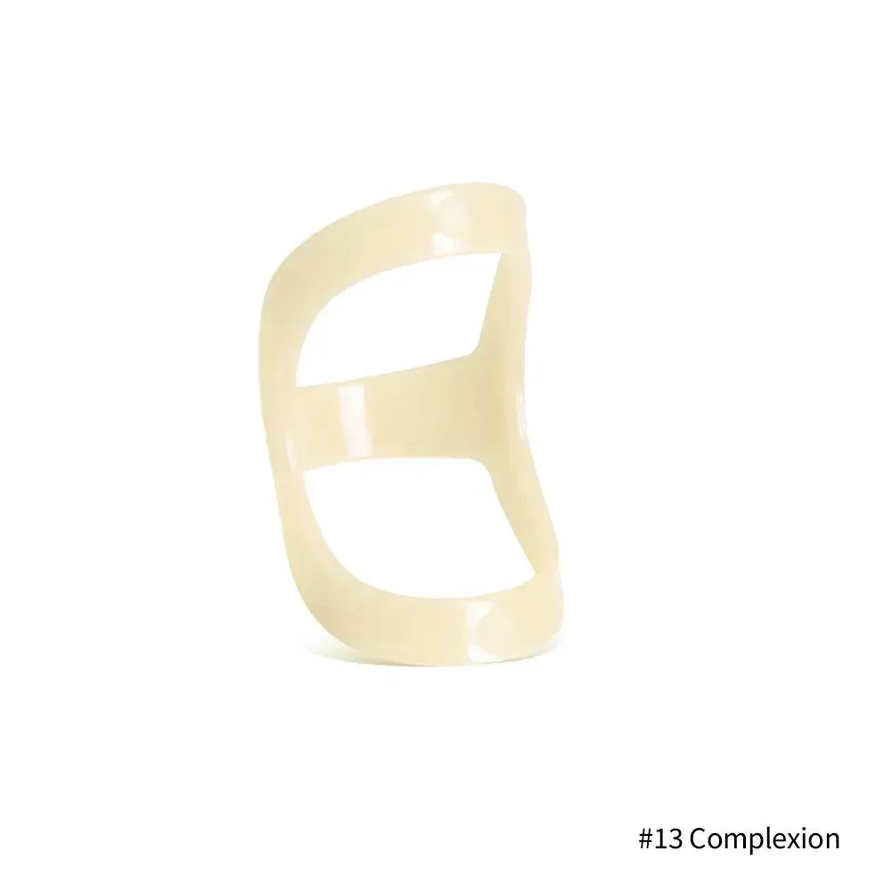 A beige ergonomic finger splint designed for joint support.