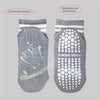 Gray non-slip grip socks designed for yoga and pilates with a cushioned bottom