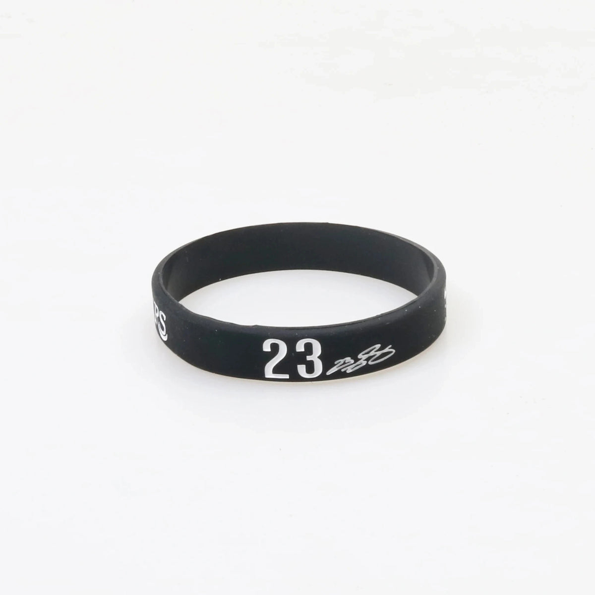 Black silicone wristband with the number 23 printed on the face