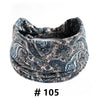 A close-up of a navy blue and beige boho print cotton headband rolled around a hand.
