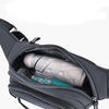 A close-up view of a gray durable nylon waist bag with an open compartment showing a rolled item.