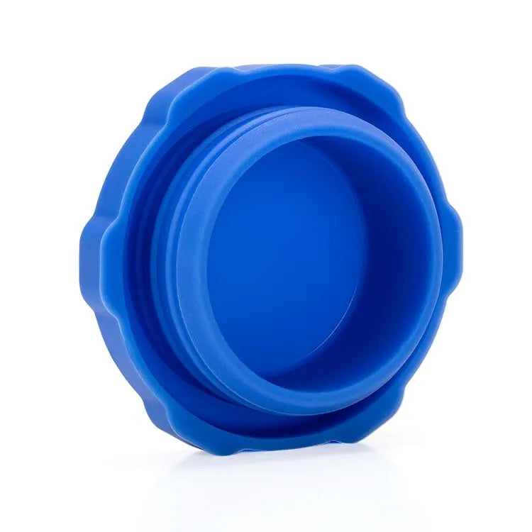 A bright blue reusable silicone water bottle lid with a textured, interlocking design.