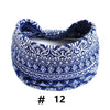 Blue and white patterned fabric knotted headband for yoga or workout