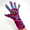 A close-up of a vibrant pink and blue patterned goalkeeper glove on a hand.