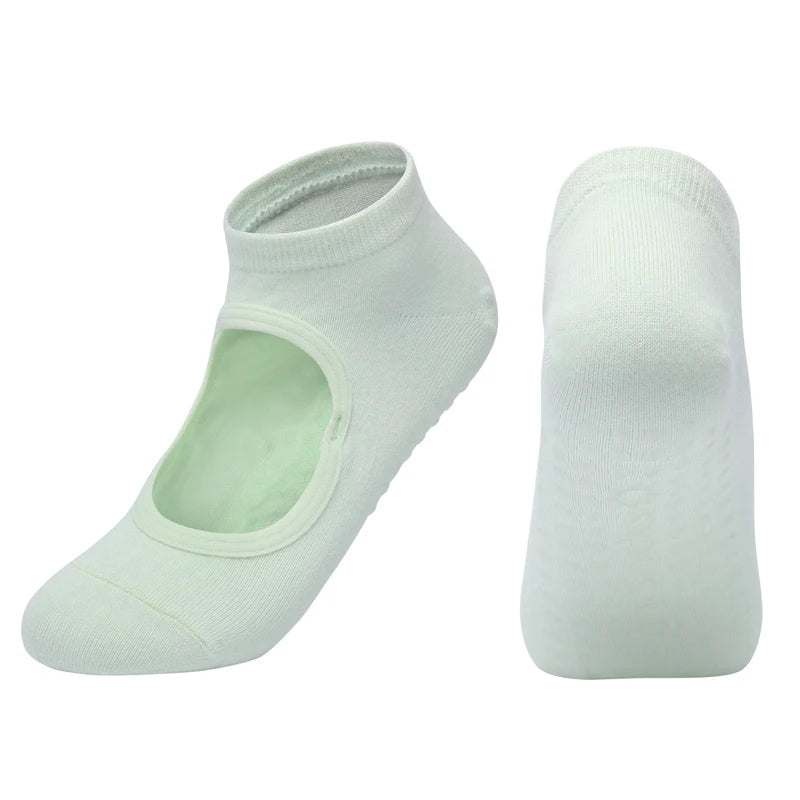 A pair of white breathable women's pilates and yoga socks shown from the side.