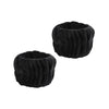 A set of black microfiber spa headband and wristband, rolled into a cylindrical shape.