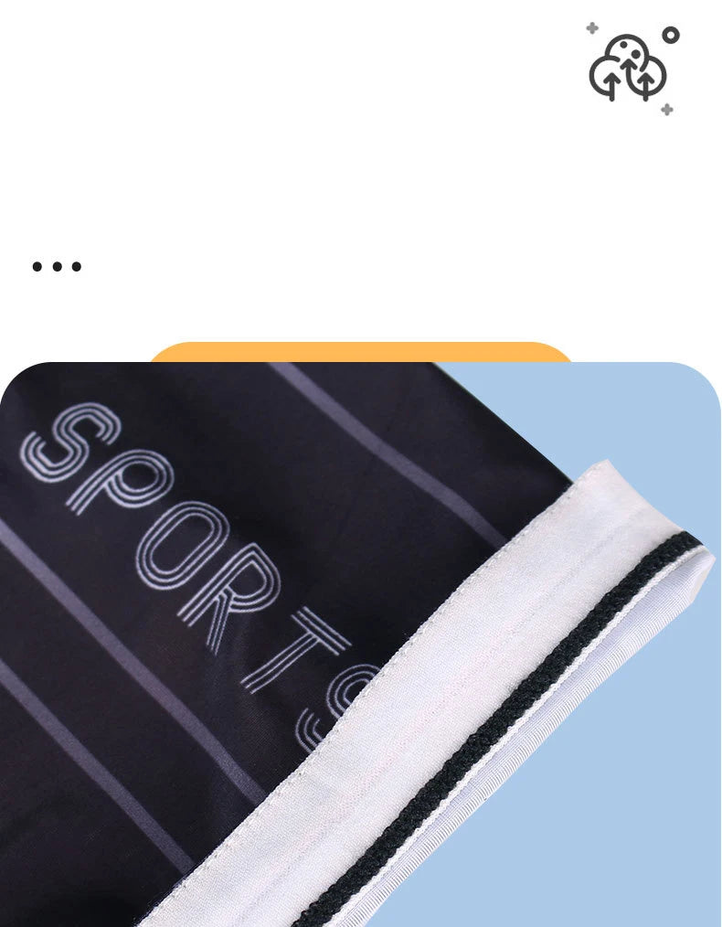 Close-up of black and white striped sports arm sleeves rolled up, showing the fabric texture.